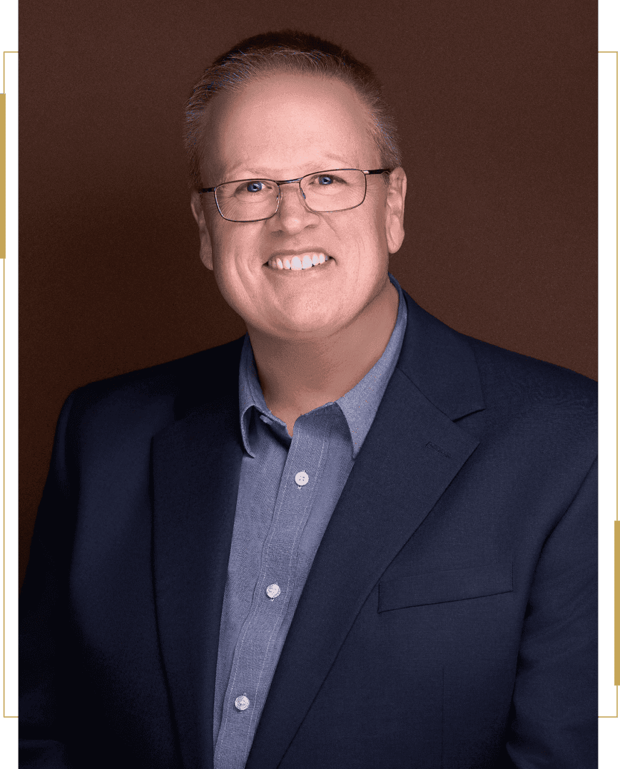 Smiling professional man with glasses, blue blazer